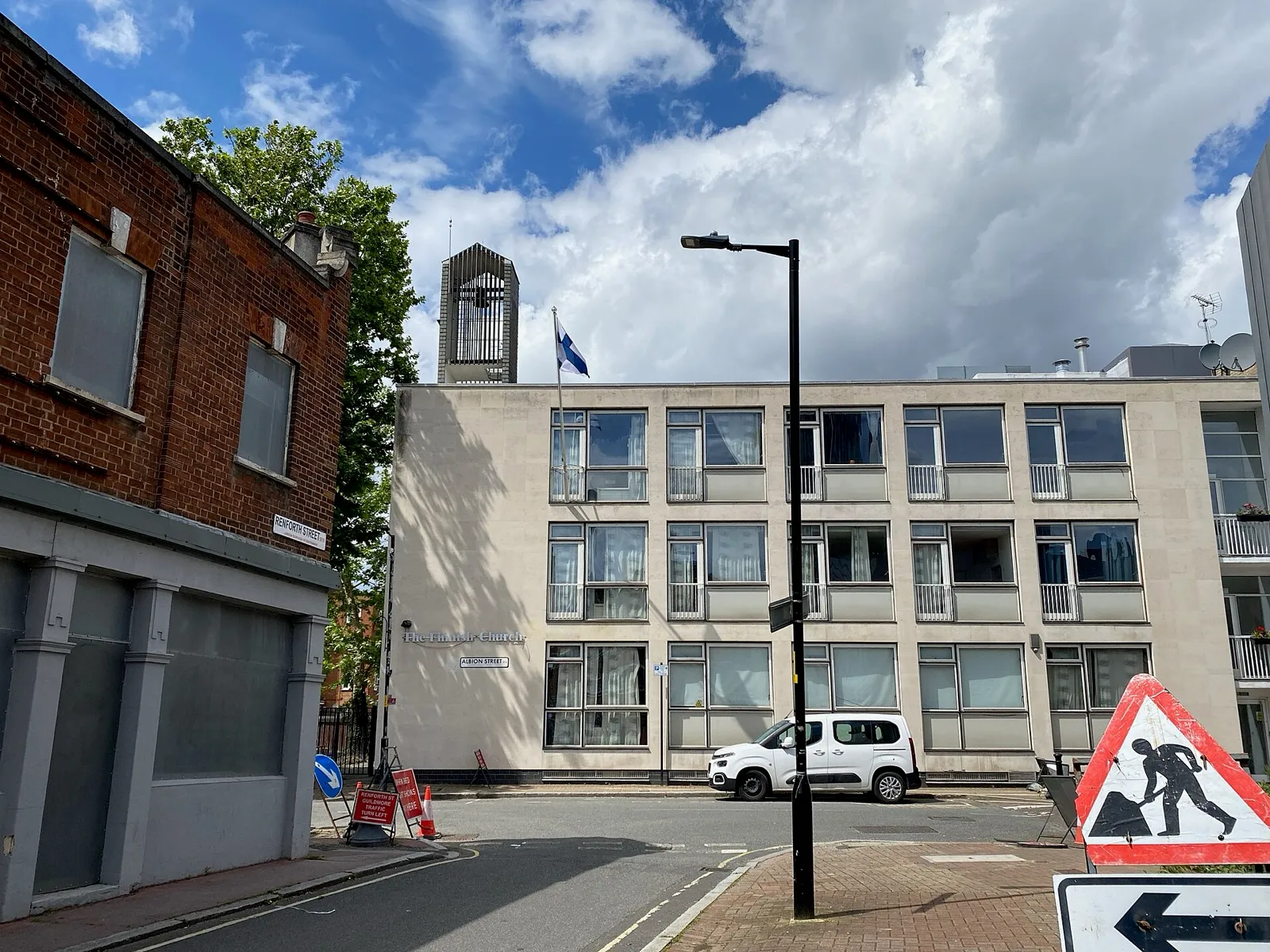 The Finnish Church in Rotherhithe, a pale modernist building with the bell tower behind