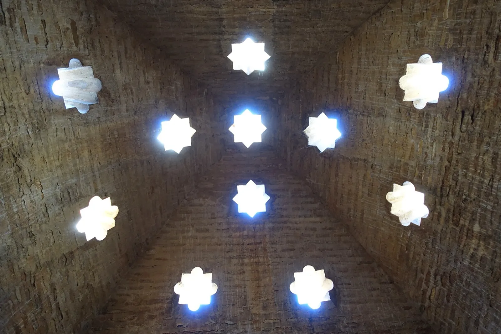 Brick vault of the Comares baths in the Alhambra, pierced by eight-pointed star-shaped skylights