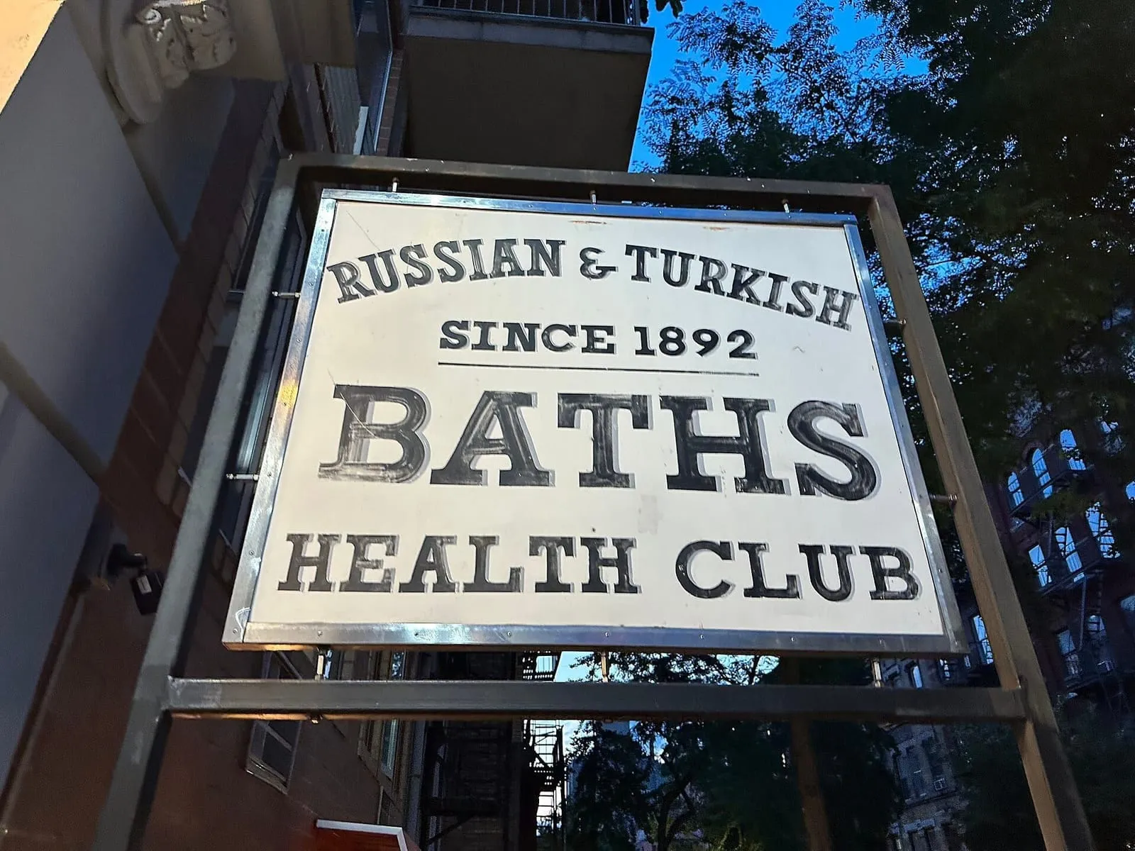 Sign of the Russian & Turkish Baths Health Club reading "since 1892" on East 10th Street